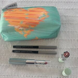 Clinique Cosmetic Collection with Teal and Orange Bag